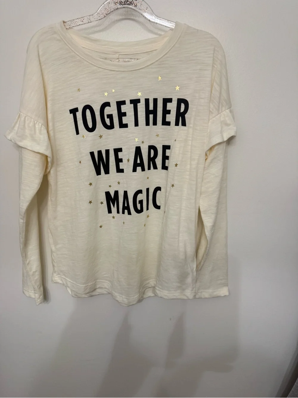 Old Navy Cream Long-Sleeve Tee with Black Text and Gold Stars